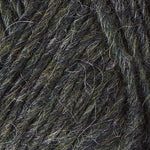 A close up photo of dark gray Istex Lettlopi yarn