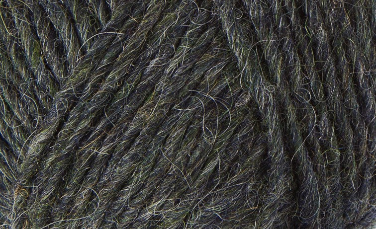 A close up photo of dark gray Istex Lettlopi yarn
