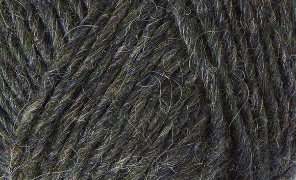 A close up photo of dark gray Istex Lettlopi yarn
