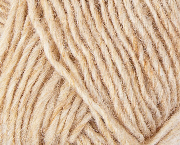 A close up photo of natural cream Istex Lettlopi yarn