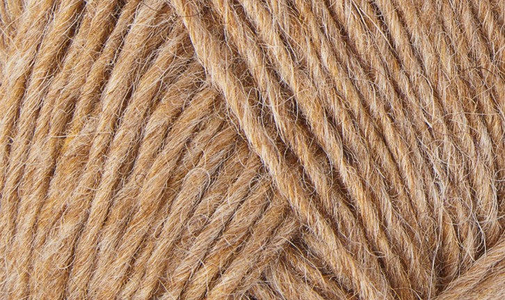 A close up photo of tan Istex Lettlopi yarn