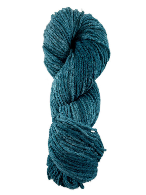A blue skein of Mountain Meadow Wool Laramie yarn
