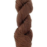 A brown skein of Mountain Meadow Wool Cora yarn