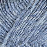 A close up photo of blue Istex Lettlopi yarn