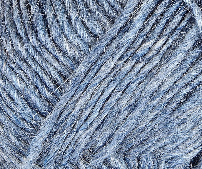 A close up photo of blue Istex Lettlopi yarn