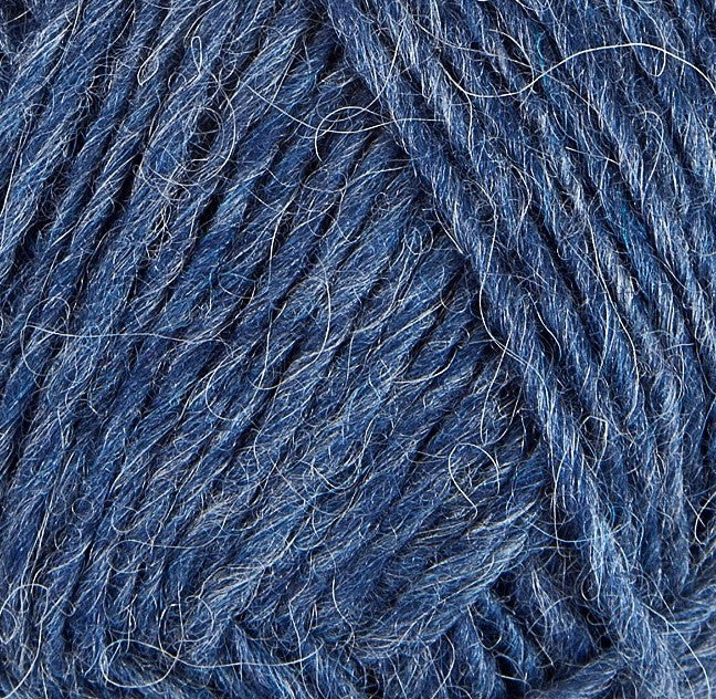 A close up photo of blue Istex Lettlopi yarn