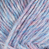 A close up photo of light blue Istex Lettlopi yarn