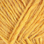 A close up photo of yellow Istex Lettlopi yarn