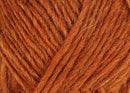 A close up photo of orange Istex Lettlopi yarn