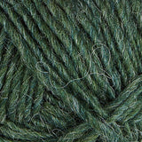 A close up photo of dark green Istex Lettlopi yarn