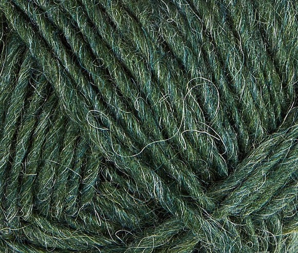 A close up photo of dark green Istex Lettlopi yarn