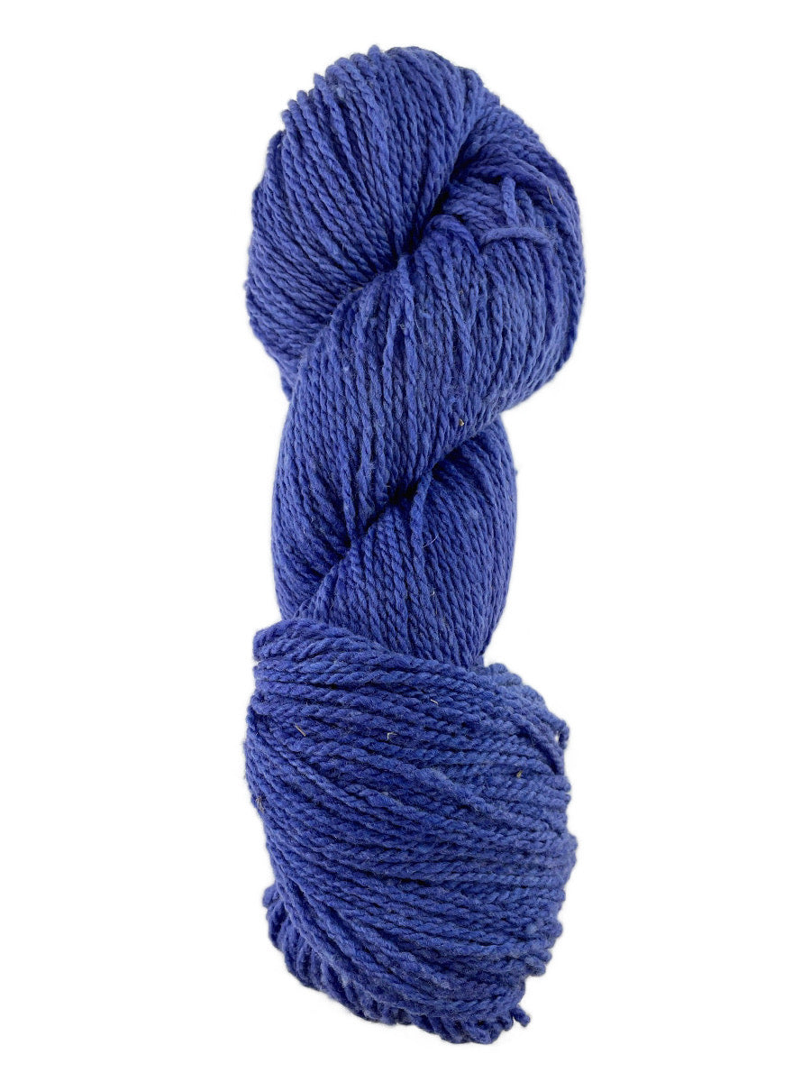 A violet skein of Mountain Meadow Wool Laramie yarn