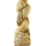 An orange skein of Mountain Meadow Wool Cora yarn