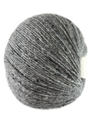 A light grey skein of Queensland Collection Kathmandu yarn