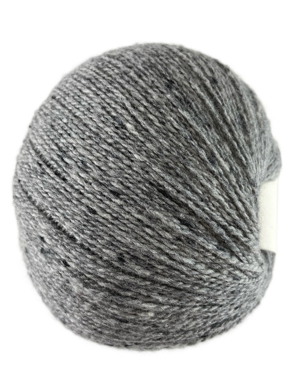 A light grey skein of Queensland Collection Kathmandu yarn