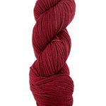 A red skein of Mountain Meadow Wool Cora yarn