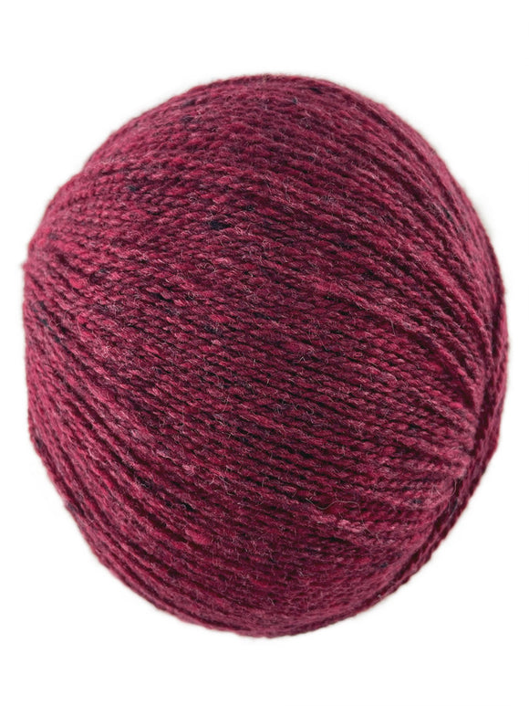 A raspberry red skein of Queensland Collection Kathmandu yarn