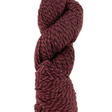 A red marled skein of Mountain Meadow Wool Cora yarn