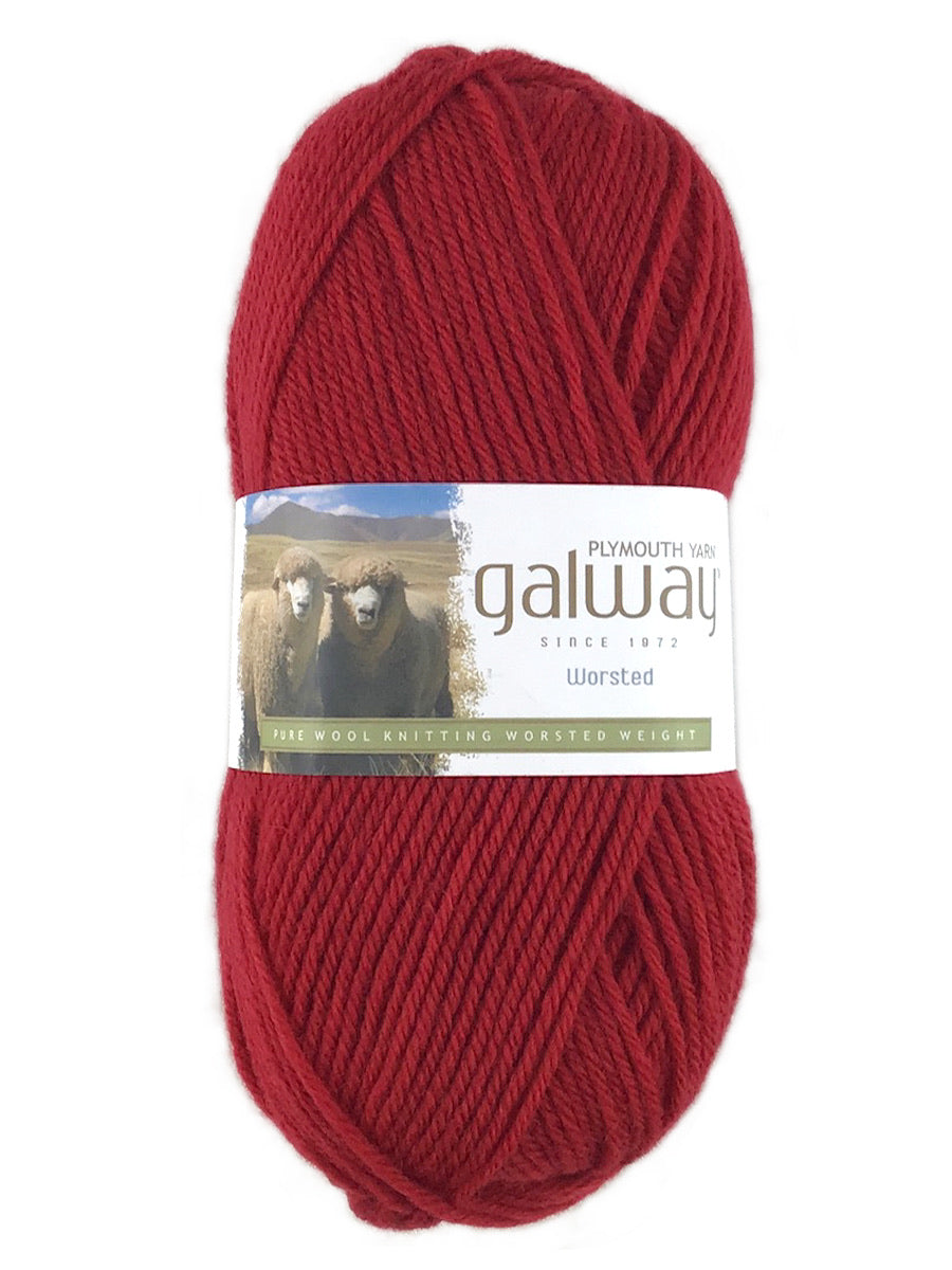 A red skein of Plymouth Galway yarn