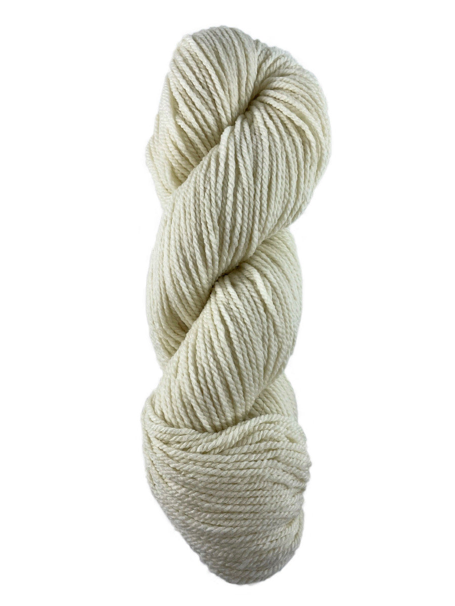 A white skein of Mountain Meadow Wool Cora yarn
