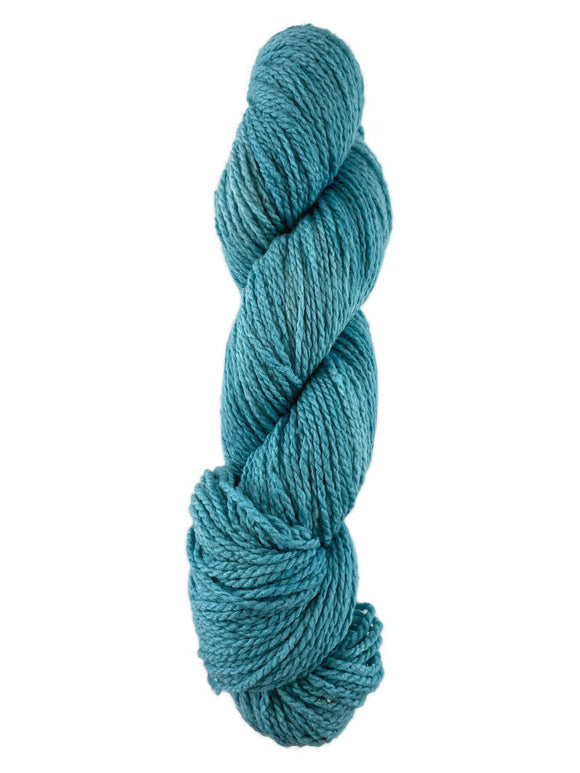 A blue skein of Mountain Meadow Wool Laramie yarn