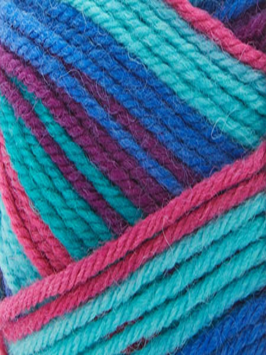 Close up of a skein of Deluxe Stripes in colorway 311 Tie Dye