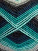 Close up of a skein of Deluxe Stripes in colorway 308 Nebula