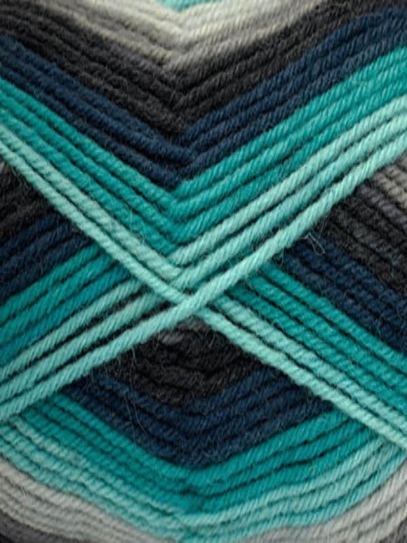 Close up of a skein of Deluxe Stripes in colorway 308 Nebula