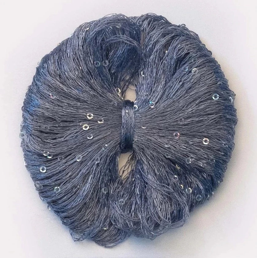 A denim ball of Lana Gatto Paillettes yarn