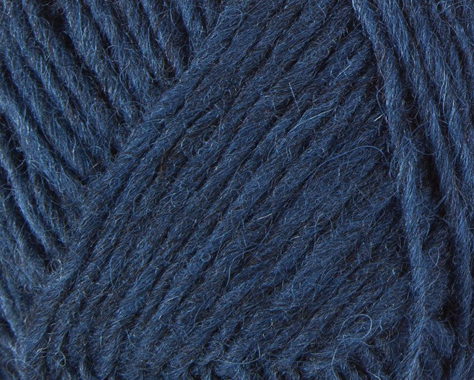 A close up photo of blue Istex Lettlopi yarn