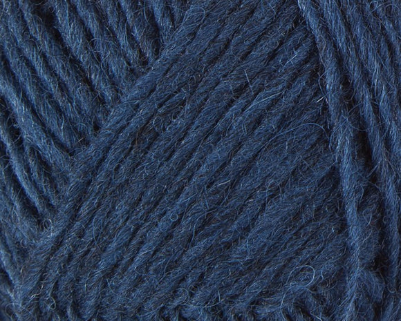 A close up photo of blue Istex Lettlopi yarn