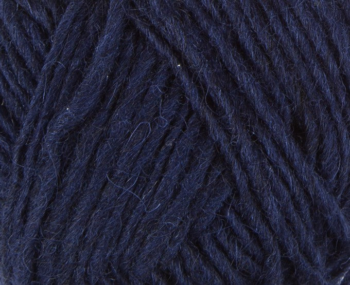 A close up photo of blue Istex Lettlopi yarn