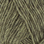 A close up photo of light tan-green Istex Lettlopi yarn