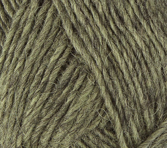 A close up photo of light tan-green Istex Lettlopi yarn