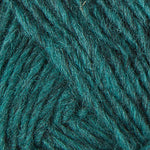 A close up photo of teal Istex Lettlopi yarn