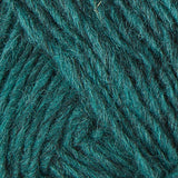 A close up photo of teal Istex Lettlopi yarn