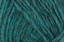 A close up photo of teal Istex Lettlopi yarn