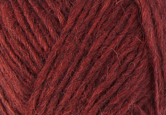 A close up photo of red Istex Lettlopi yarn