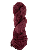 A red skein of Mountain Meadow Wool Laramie yarn