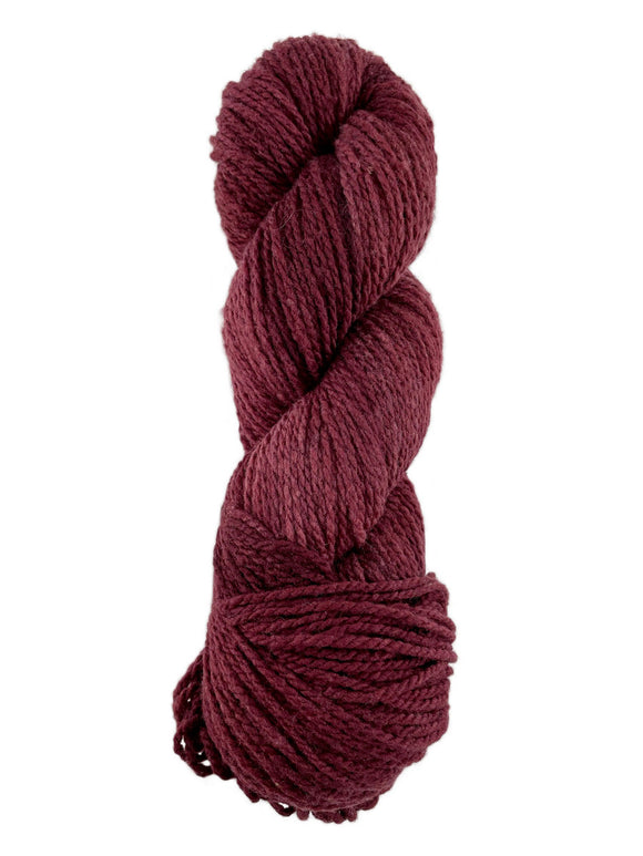 A red skein of Mountain Meadow Wool Laramie yarn