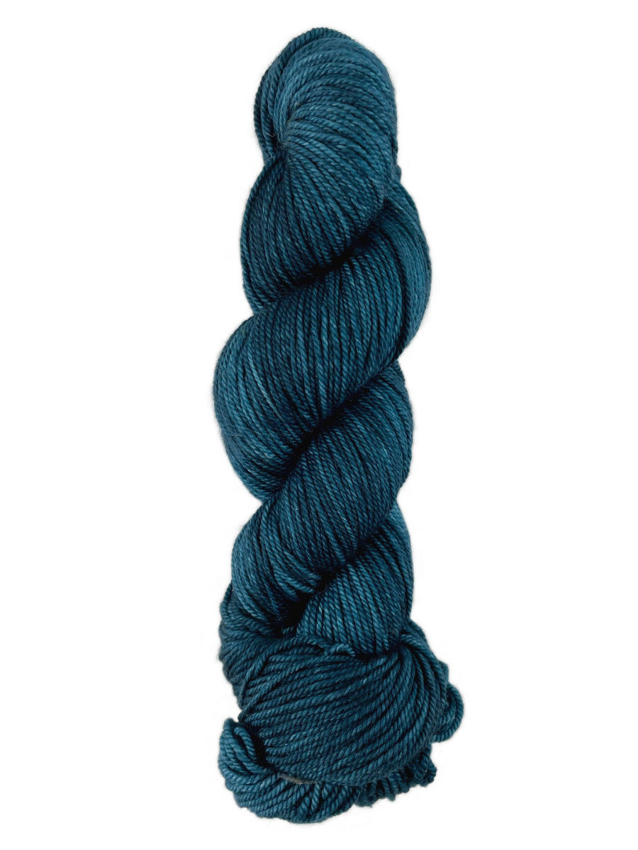 A blue skein of Western Sky Knits Merino 17 DK yarn