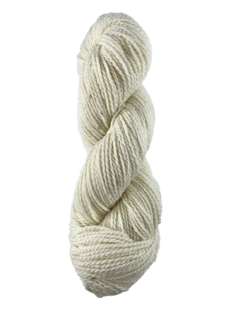 A white skein of Mountain Meadow Wool Laramie Natural yarn