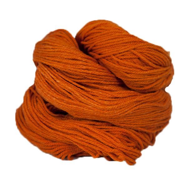 An orange hank of the Mountain Meadow Wool Alpine collection.