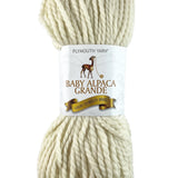 A white skein of Plymouth Baby Alpaca Grande yarn
