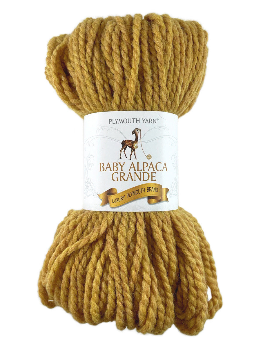 A gold skein of Plymouth Baby Alpaca Grande yarn