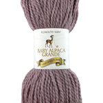 A pink heather skein of Plymouth Baby Alpaca Grande yarn