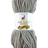 A grey skein of Plymouth Baby Alpaca Grande yarn
