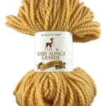 A yellow skein of Plymouth Baby Alpaca Grande yarn