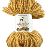 A yellow skein of Plymouth Baby Alpaca Grande yarn