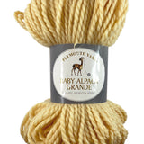 A yellow skein of Plymouth Baby Alpaca Grande yarn